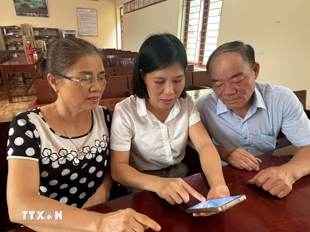 ttxvn-dang-vien-sinh-hoat-chi-bo-1-nghi-quyet-57-2.jpg